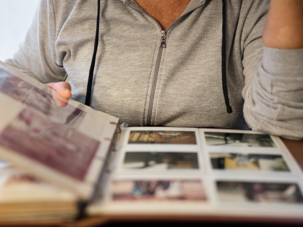 woman looking through family photos represents political differences