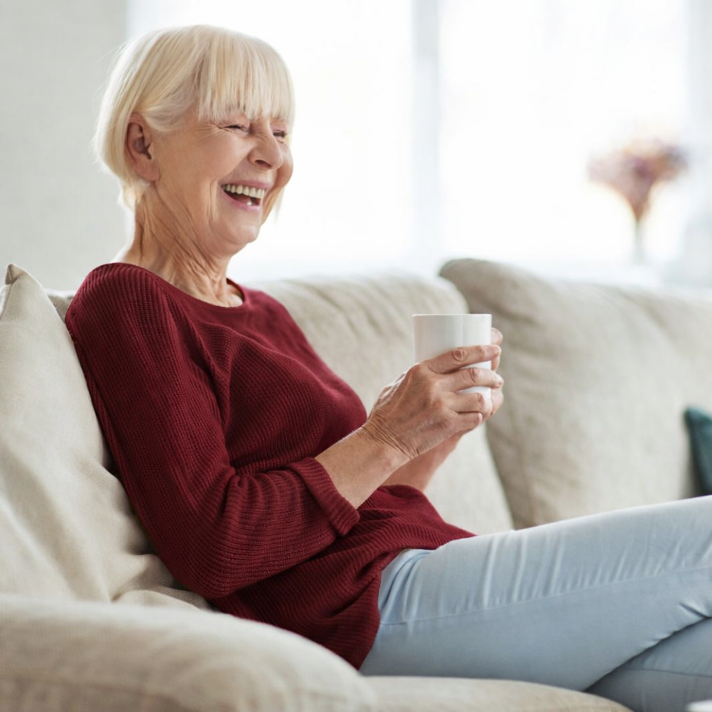 Older woman in menopause sits in office receiving individual therapy