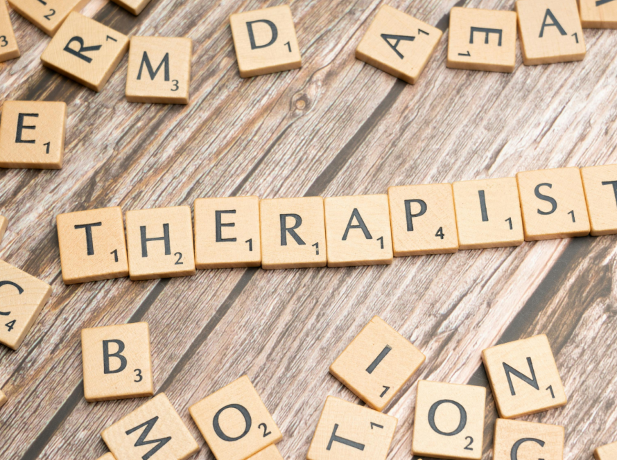 Trauma therapist reflecting during a therapy session, representing curiosity, lifelong learning, and trauma-informed professional development.